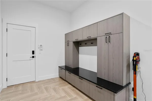 a utility room with sink dryer and washer