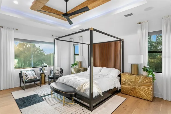 a view of a house with a backyard porch and sitting area