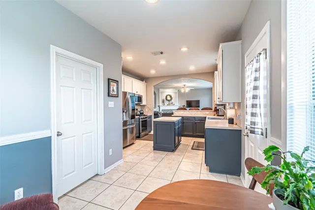 a kitchen with a refrigerator and a microwave