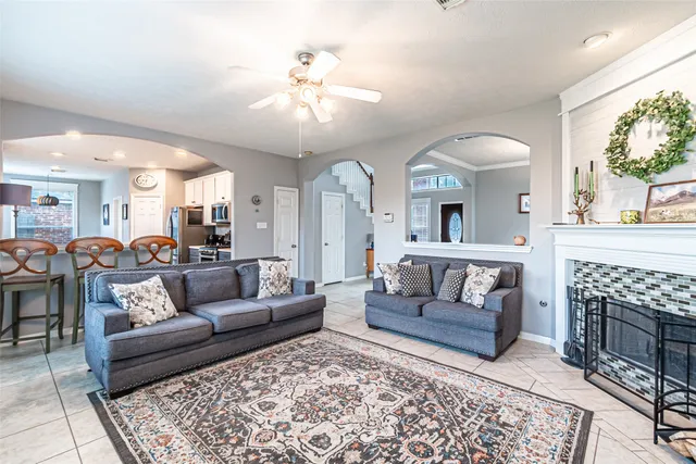 a living room with furniture and a fireplace