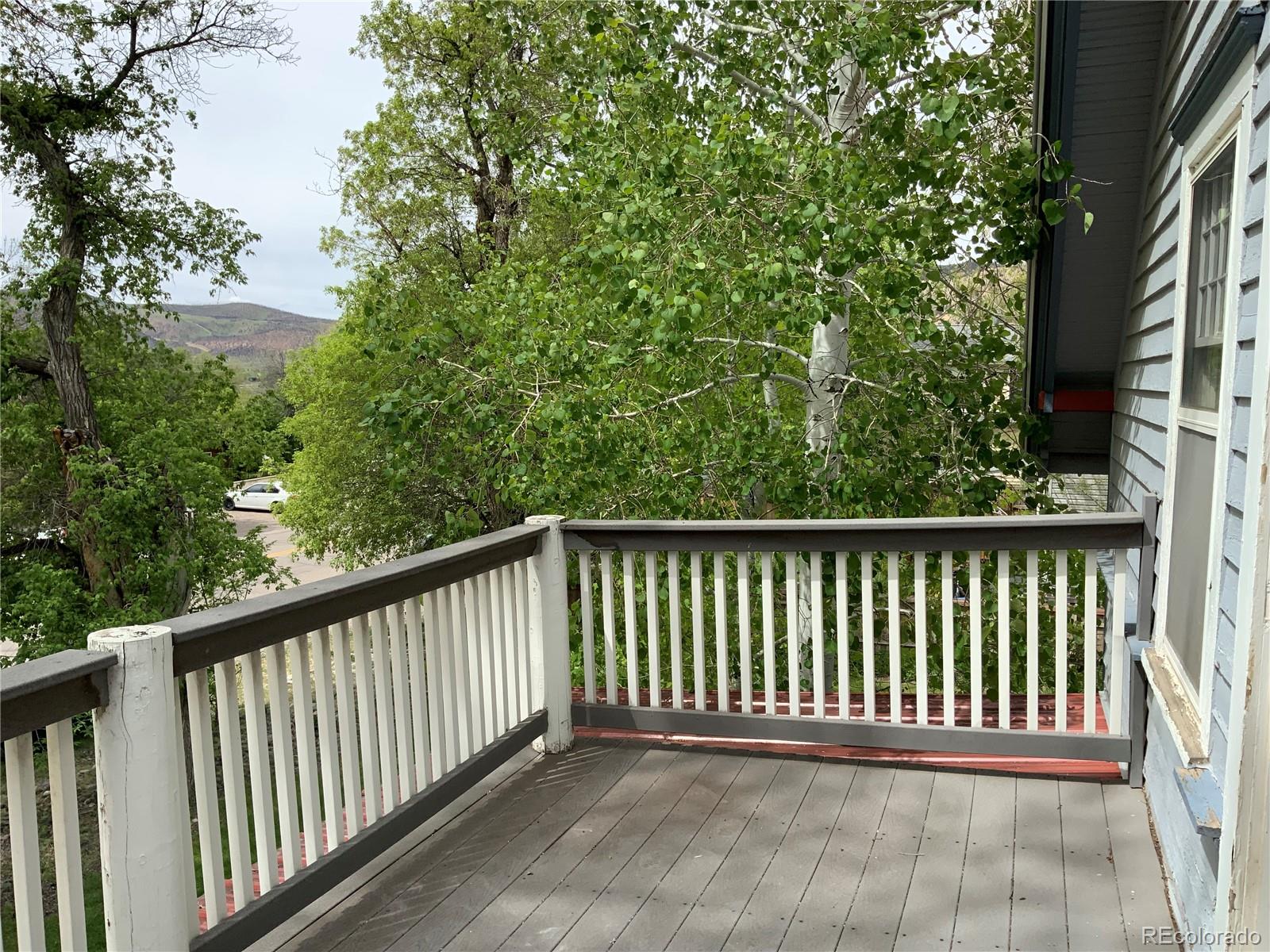 1011 Main Street Meeker, CO 81641 - Photo 16 of 28 a balcony with trees in front of it