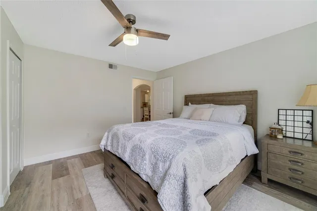 a bedroom with bed and window