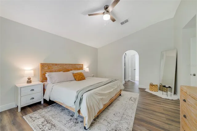 a bedroom with a bed and a dresser