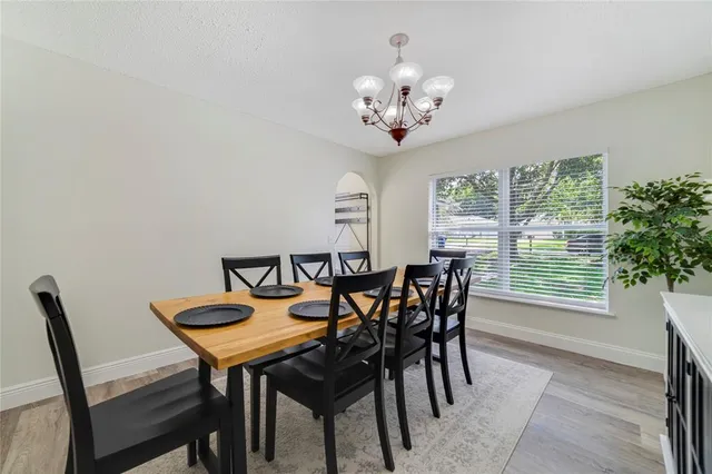 a view of a dining room with furniture window and outside view