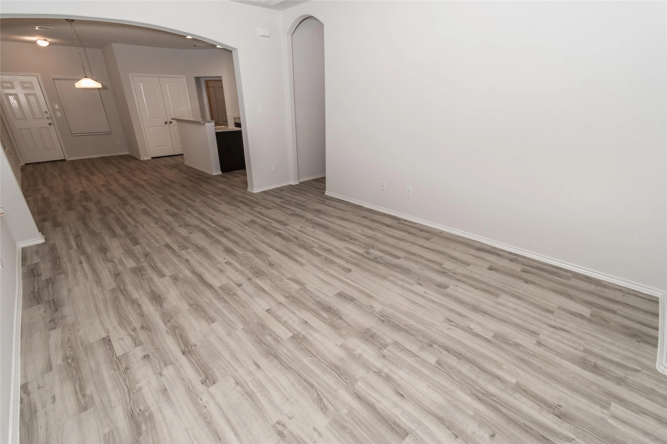 8711 Lar Ree Oaks Circle Houston, TX 77028 - Photo 3 of 8 a view of a room with wooden floor