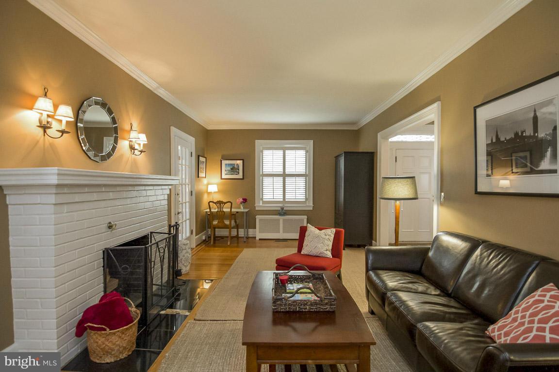 6209 Pinehurst Road Baltimore, MD 21212 - Photo 3 of 29 a living room with furniture and a fireplace