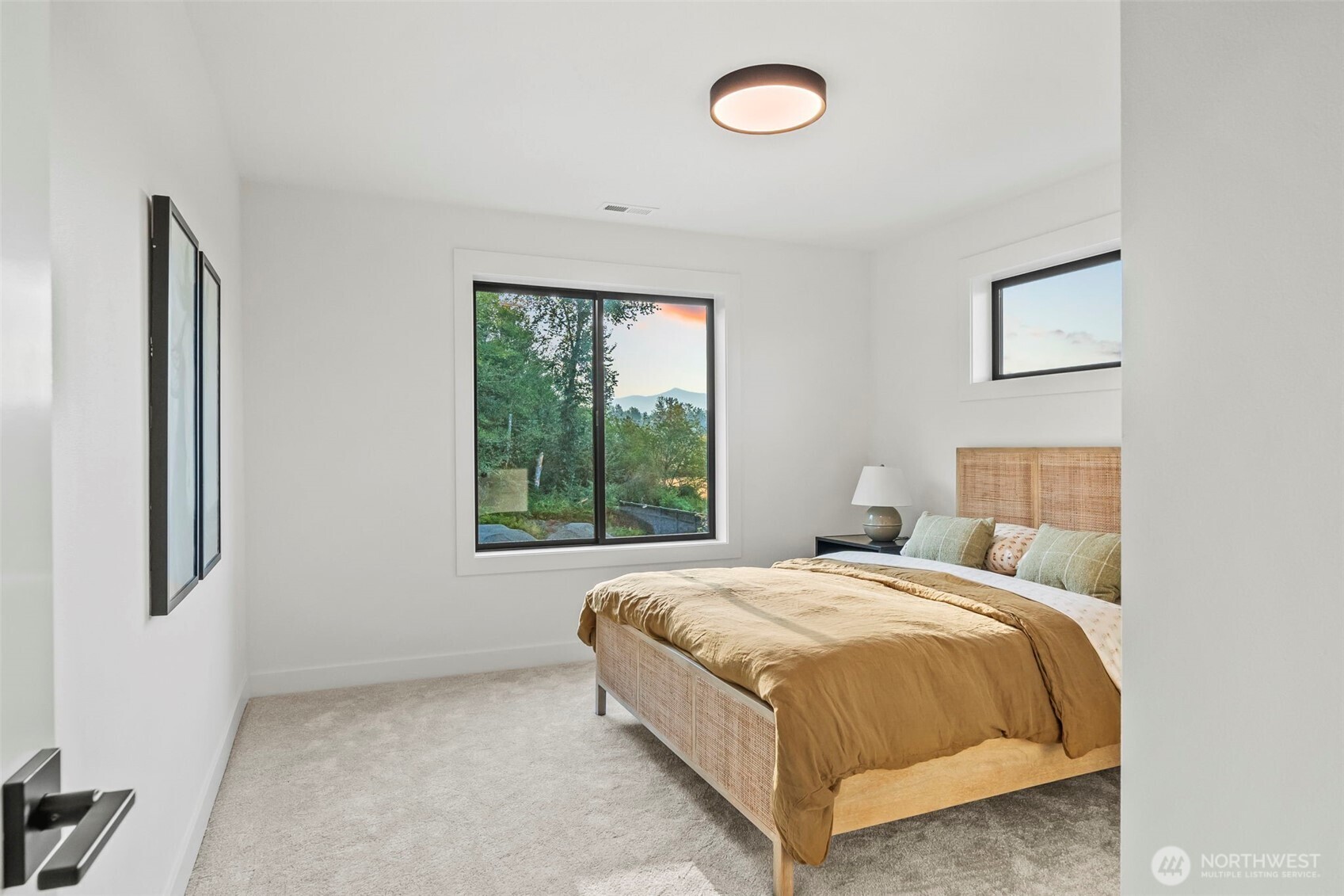 12107 Mundy Loss Road Buckley, WA 98321 - Photo 31 of 40 a bed sitting in a bedroom next to a window