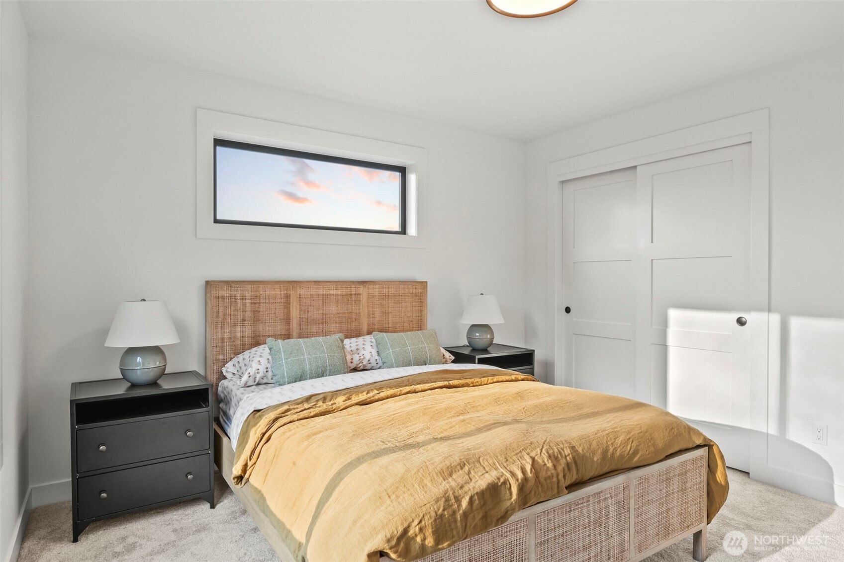 12107 Mundy Loss Road Buckley, WA 98321 - Photo 32 of 40 a bedroom with a bed and a window