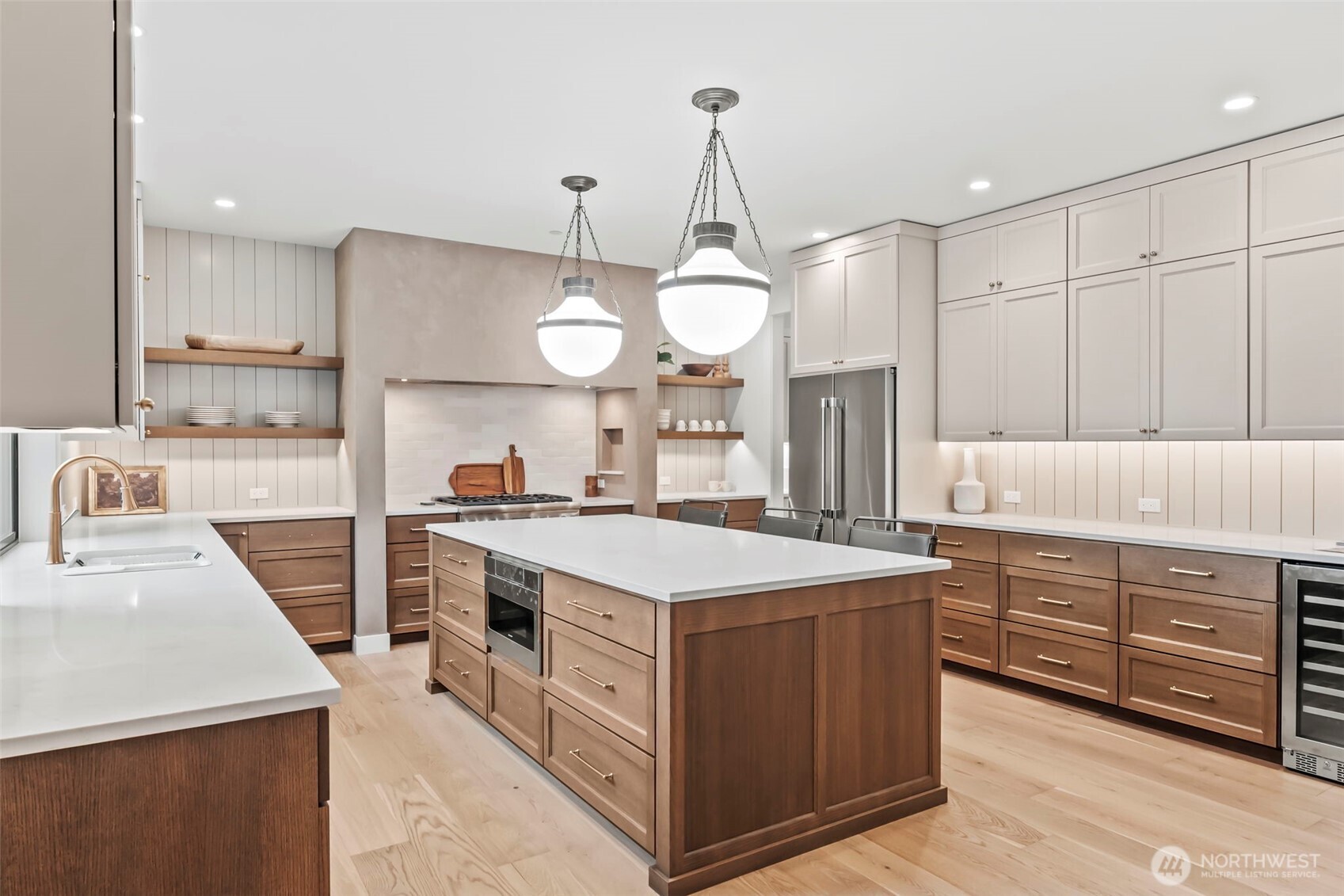 12107 Mundy Loss Road Buckley, WA 98321 - Photo 10 of 40 a kitchen that has a sink a stove and a wooden floor