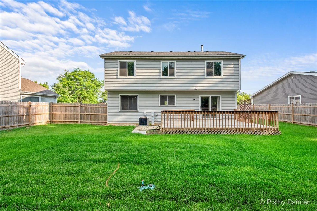 676 Concord Drive Crystal Lake, IL 60014 - Photo 30 of 38 a view of a house with a yard and deck