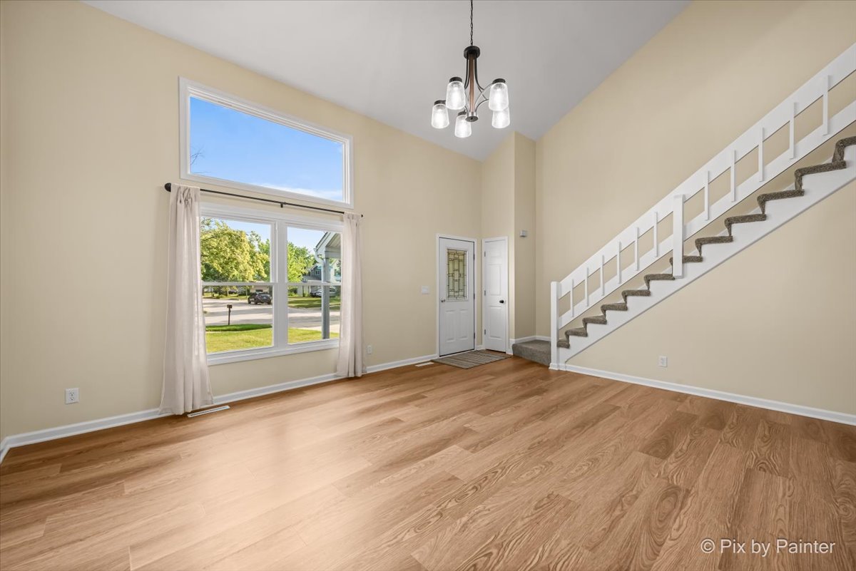 676 Concord Drive Crystal Lake, IL 60014 - Photo 5 of 38 a view of empty room with wooden floor and fan