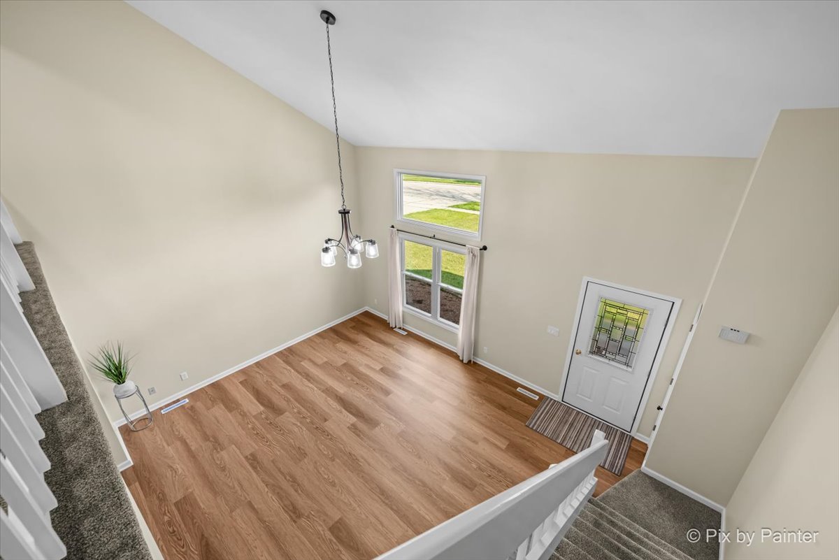 676 Concord Drive Crystal Lake, IL 60014 - Photo 6 of 38 a view of empty room with wooden floor