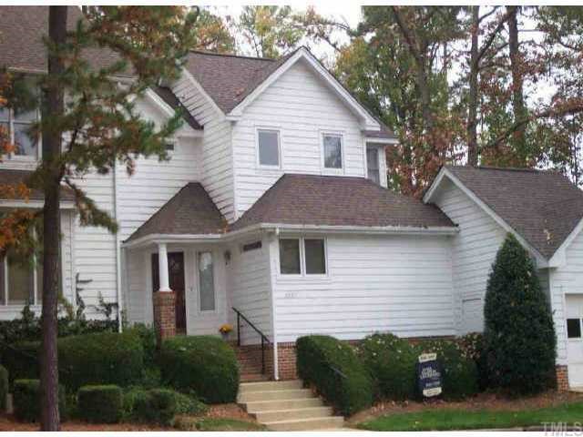 3837 Carnegie Raleigh, NC 27612 - Photo 1 of 1 a front view of a house with a yard and garage