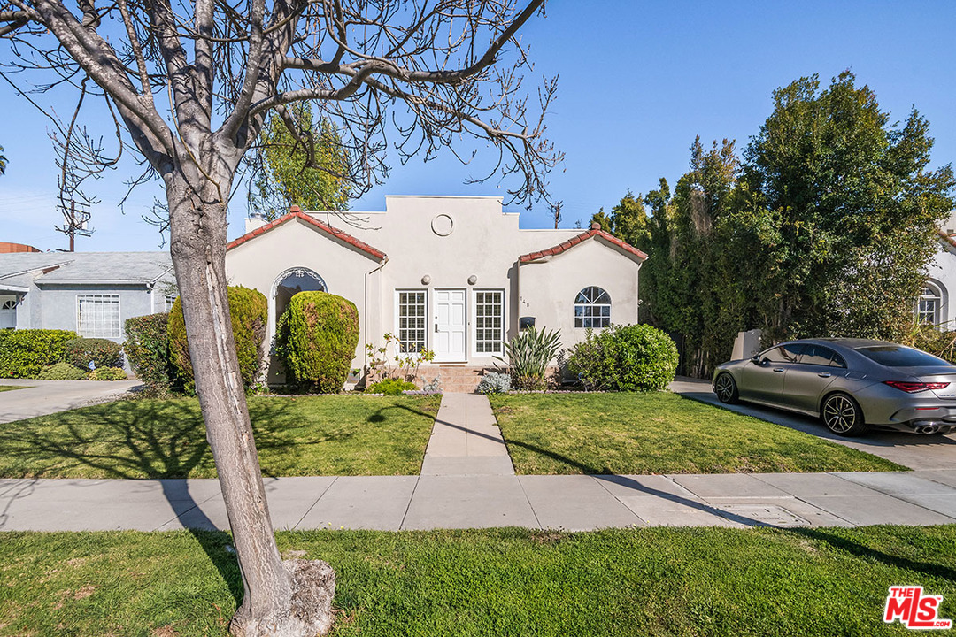 148 Le Doux Road Beverly Hills, CA 90211 - Photo 2 of 22 a front view of a house with garden