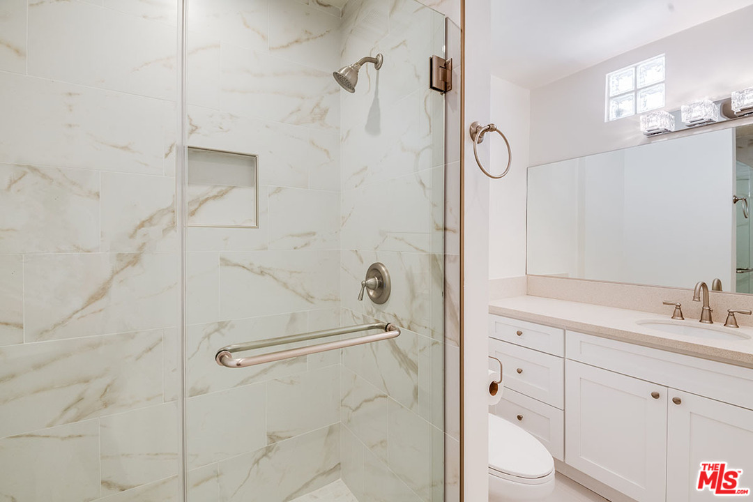 148 Le Doux Road Beverly Hills, CA 90211 - Photo 14 of 22 a bathroom with a sink a toilet and shower