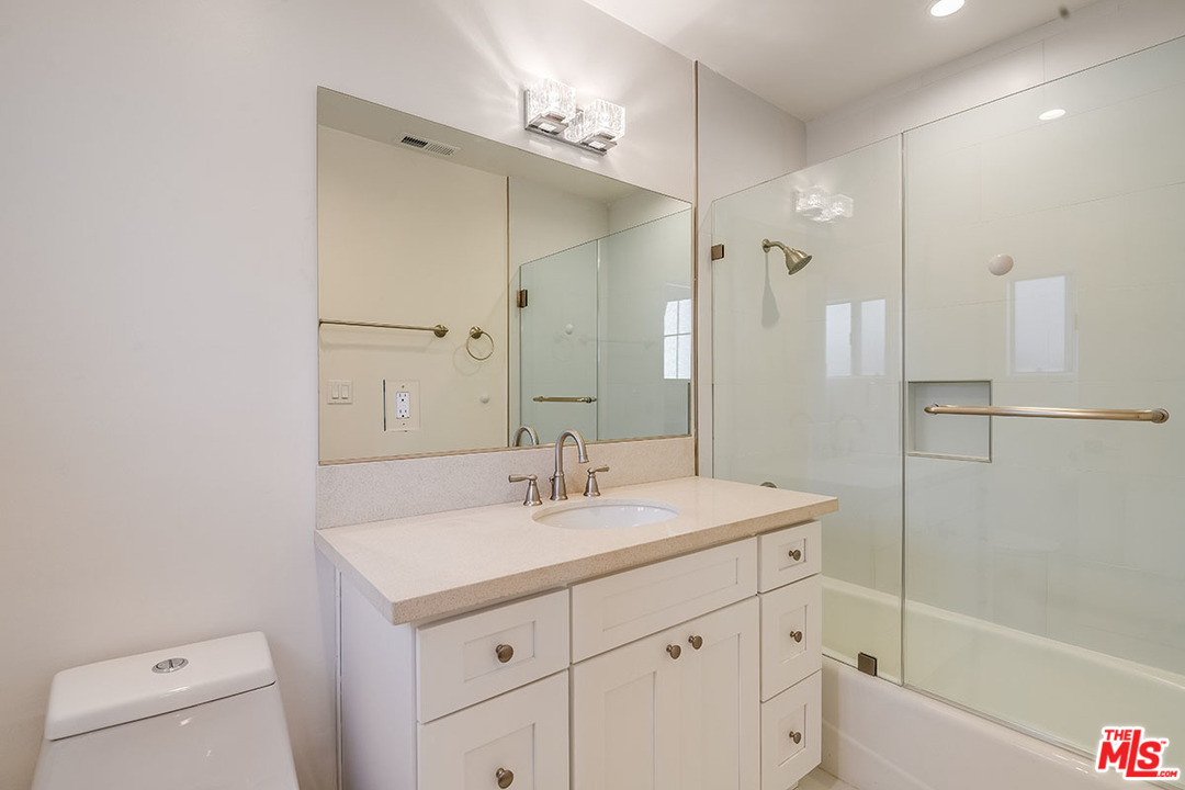 148 Le Doux Road Beverly Hills, CA 90211 - Photo 16 of 22 a bathroom with a sink a toilet and shower