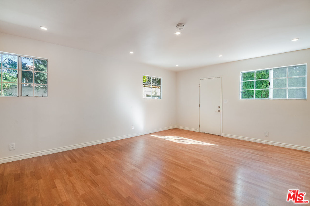 148 Le Doux Road Beverly Hills, CA 90211 - Photo 9 of 22 an empty room with windows