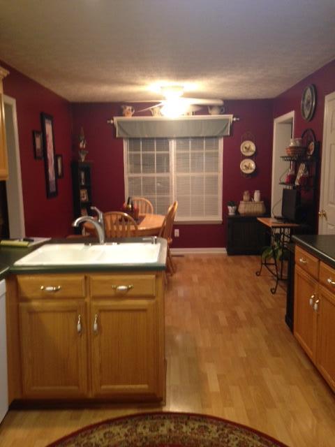 277 Bradshaw Road Lebanon, TN 37087 - Photo 11 of 30 a kitchen with a sink and wooden cabinets