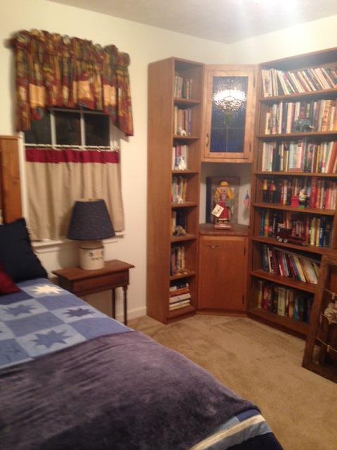 277 Bradshaw Road Lebanon, TN 37087 - Photo 28 of 30 a bedroom with a bed and a book shelf