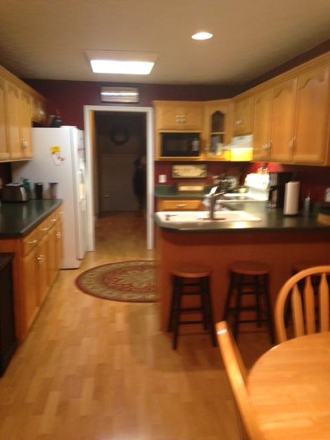 277 Bradshaw Road Lebanon, TN 37087 - Photo 10 of 30 a kitchen with stainless steel appliances granite countertop a sink a stove and a refrigerator