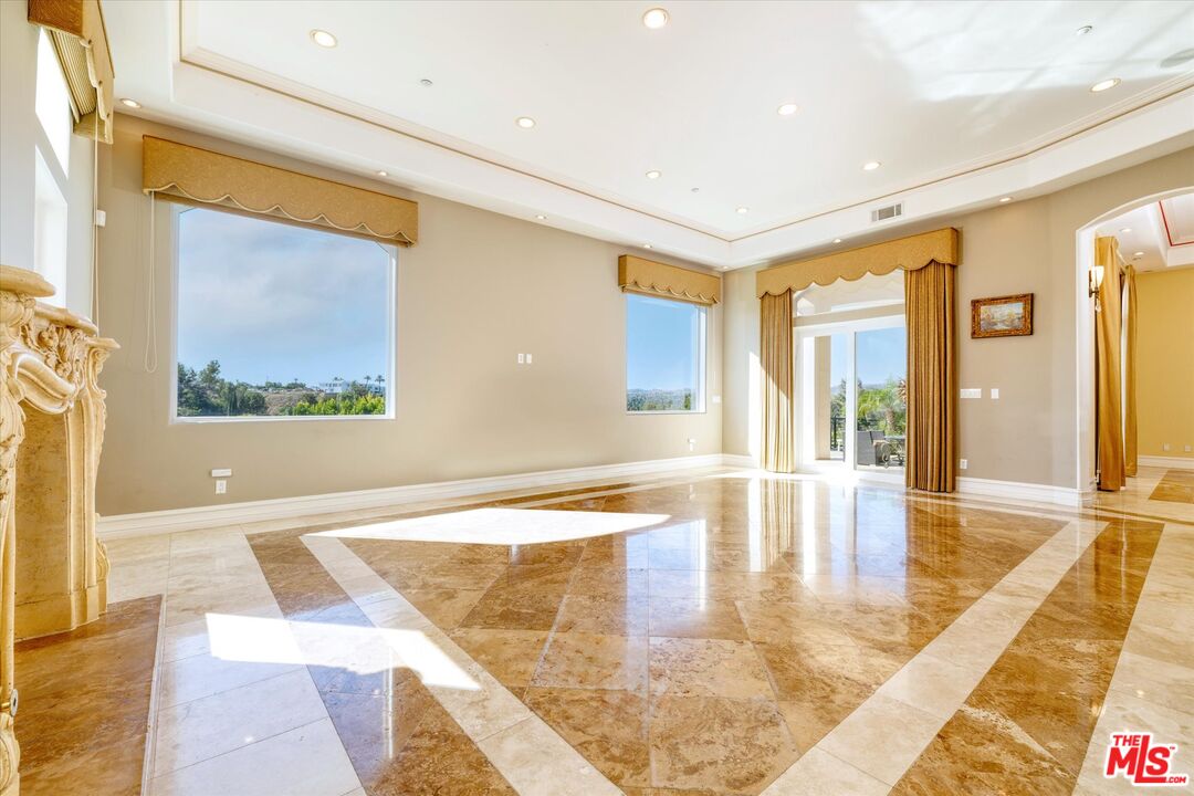 22470 Sueno Road Woodland Hills, CA 91364 - Photo 15 of 18 a view of an entryway with wooden floor and a rug