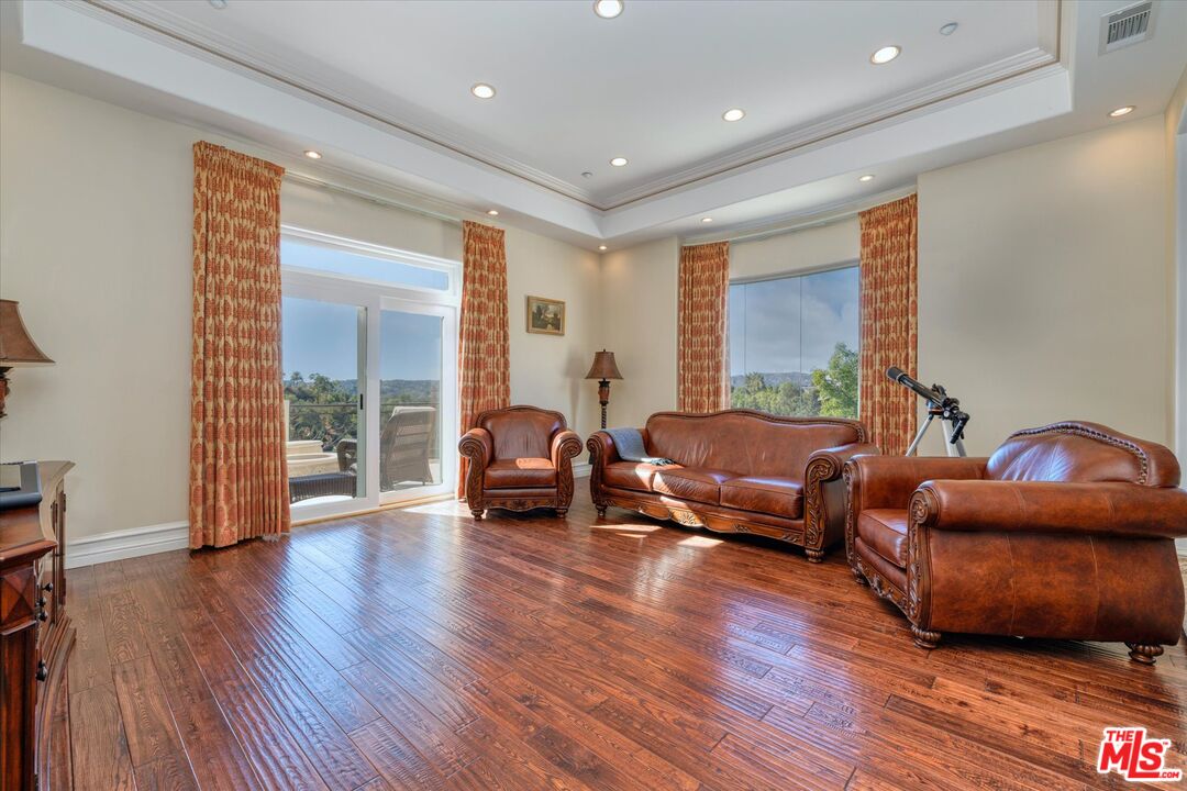 22470 Sueno Road Woodland Hills, CA 91364 - Photo 18 of 18 a living room with furniture and a wooden floor