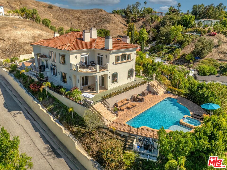 22470 Sueno Road Woodland Hills, CA 91364 - Photo 3 of 18 an aerial view of residential houses with outdoor space