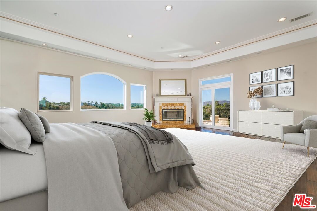 22470 Sueno Road Woodland Hills, CA 91364 - Photo 8 of 18 a spacious bedroom with a large bed and a large window