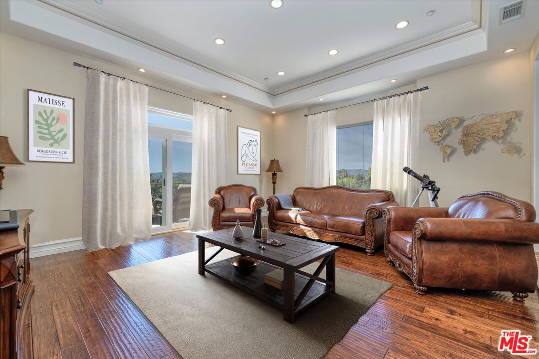 22470 Sueno Road Woodland Hills, CA 91364 - Photo 10 of 18 a living room with furniture and a wooden floor