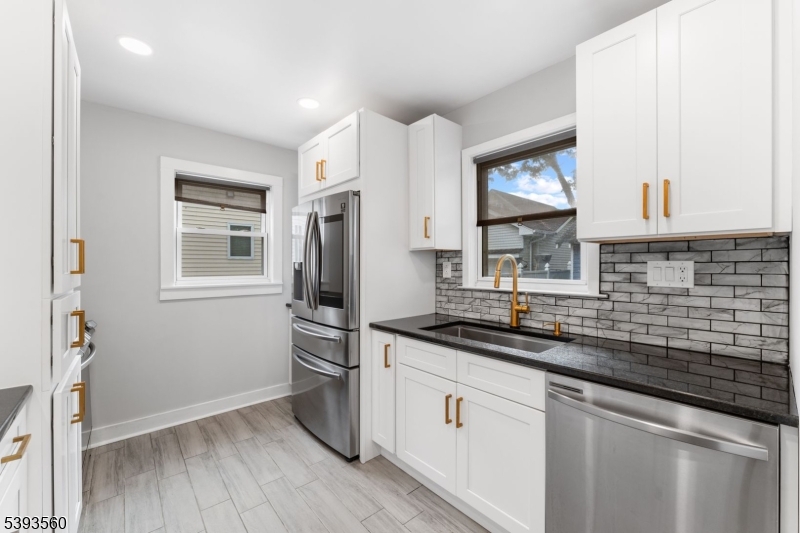 177 West Pierrepont Avenue Rutherford, NJ 07070 - Photo 15 of 27 a kitchen with a sink stove and refrigerator