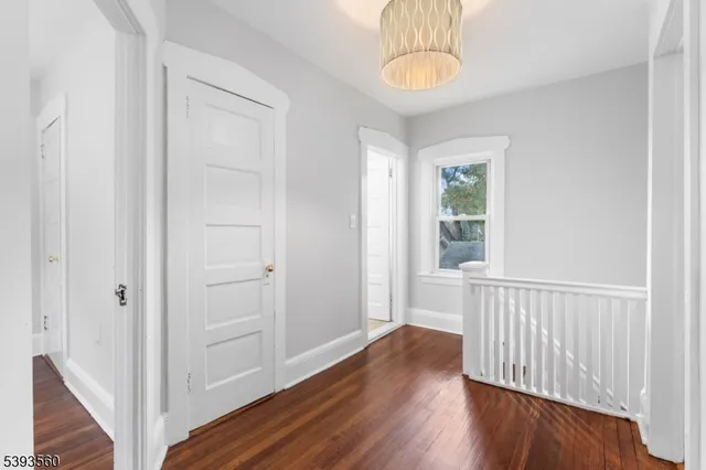 a view of an entryway with wooden floor