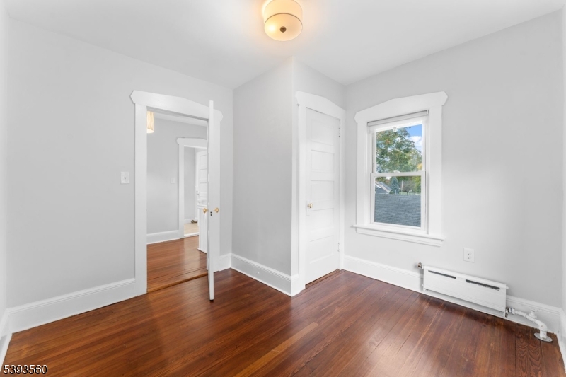 177 West Pierrepont Avenue Rutherford, NJ 07070 - Photo 24 of 27 an empty room with wooden floor and windows