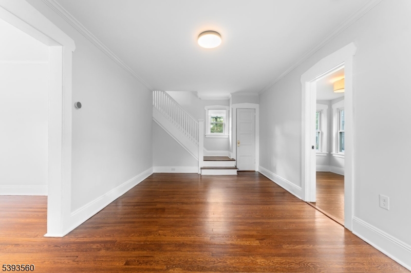 177 West Pierrepont Avenue Rutherford, NJ 07070 - Photo 4 of 27 a view of an empty room with wooden floor and a window