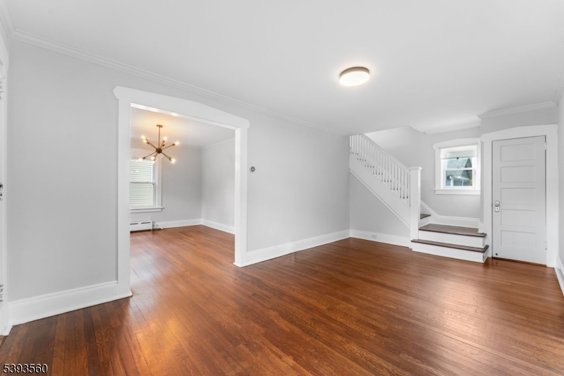 177 West Pierrepont Avenue Rutherford, NJ 07070 - Photo 5 of 27 an empty room with wooden floor and windows