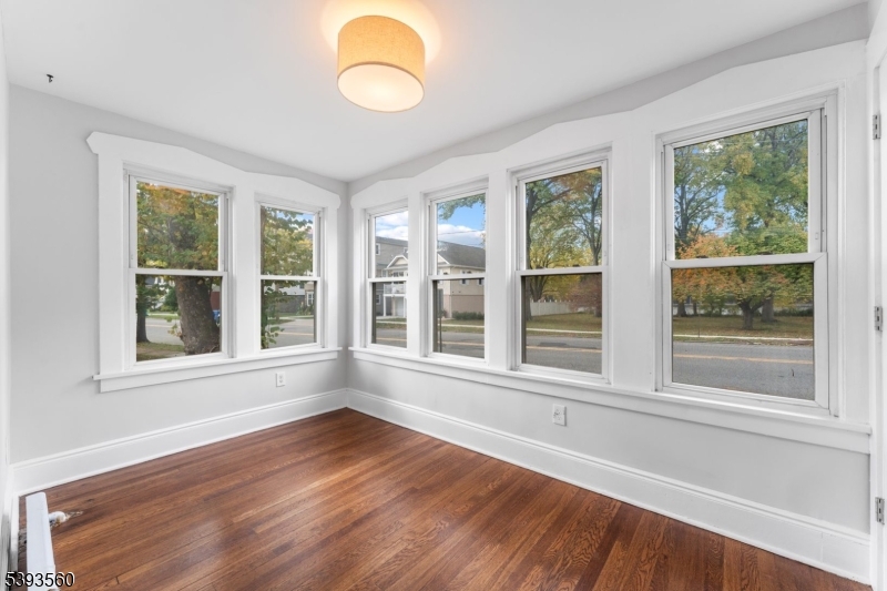 177 West Pierrepont Avenue Rutherford, NJ 07070 - Photo 9 of 27 a view of an empty room with wooden floor and a window