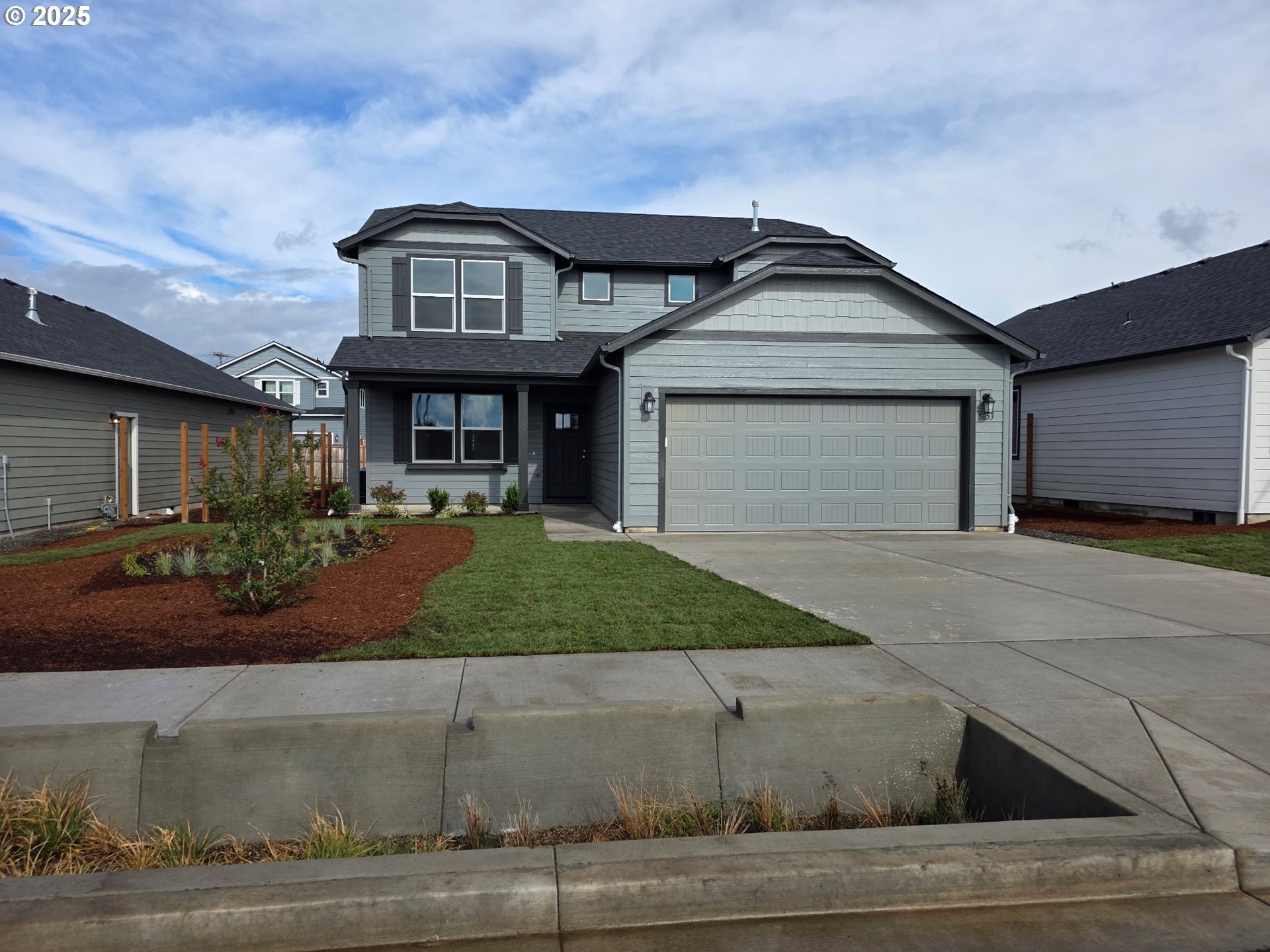 5653 Magnificence Way Eugene, OR 97402 - Photo 1 of 44 a front view of a house with garden