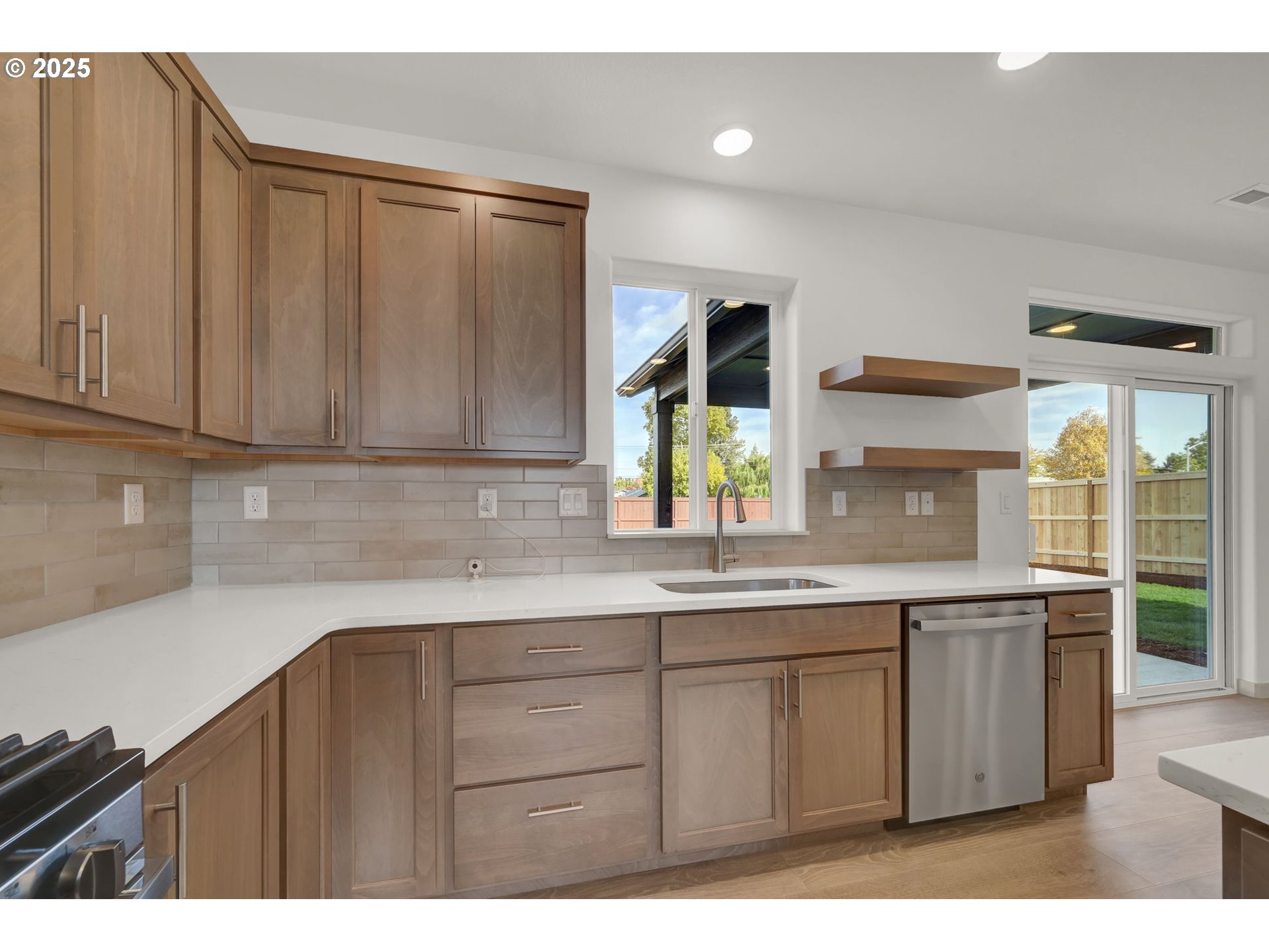 5653 Magnificence Way Eugene, OR 97402 - Photo 11 of 44 a kitchen with a sink and cabinets