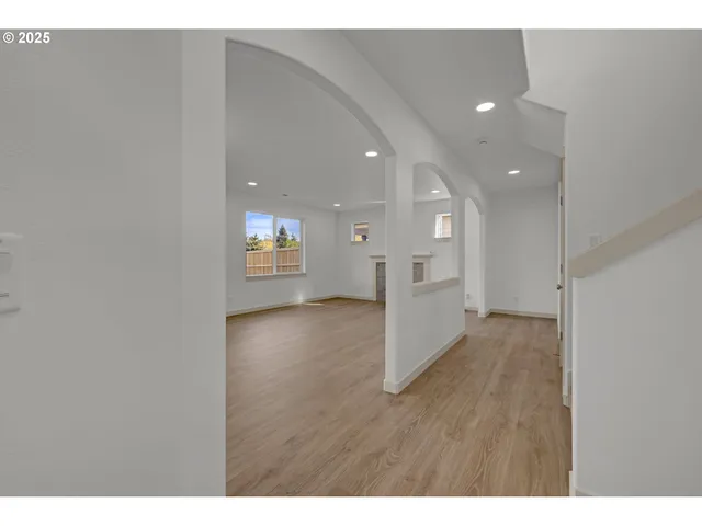 a view of an empty room and a window