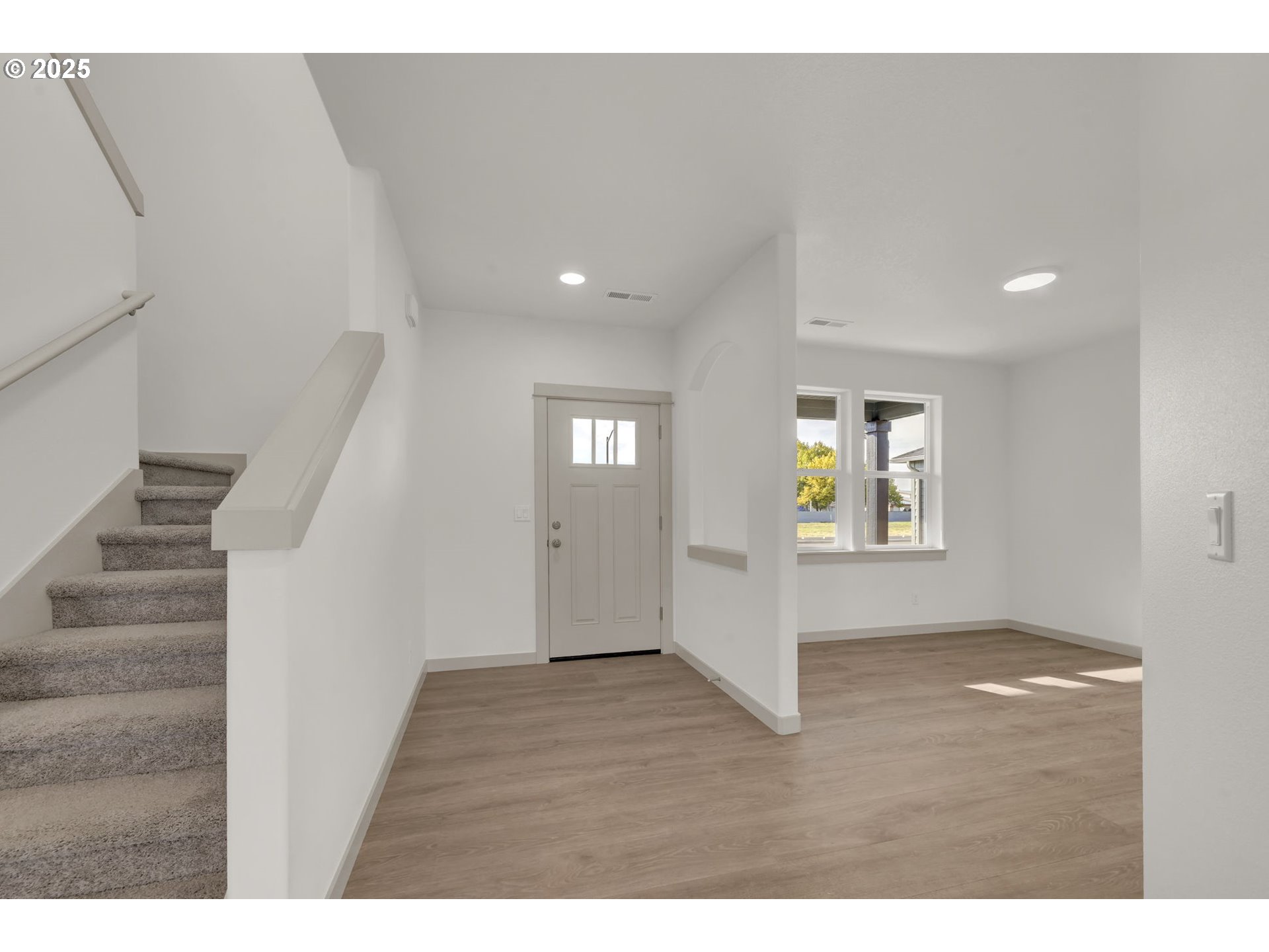 5653 Magnificence Way Eugene, OR 97402 - Photo 18 of 44 a view of entryway and hall with wooden floor