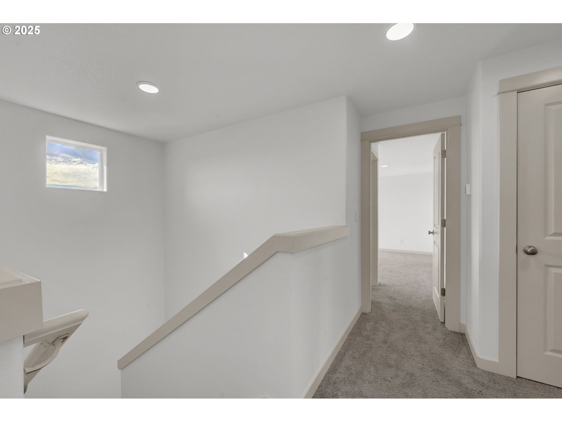 5653 Magnificence Way Eugene, OR 97402 - Photo 20 of 44 a view of a hallway with wooden floor