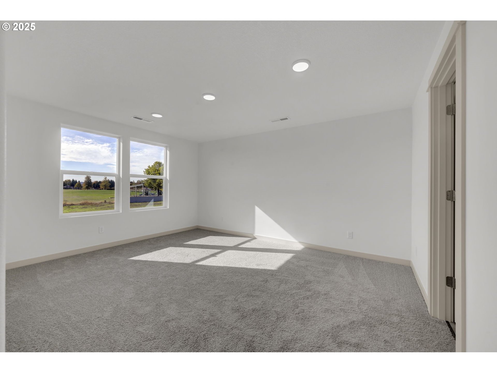 5653 Magnificence Way Eugene, OR 97402 - Photo 21 of 44 a view of an empty room with a window