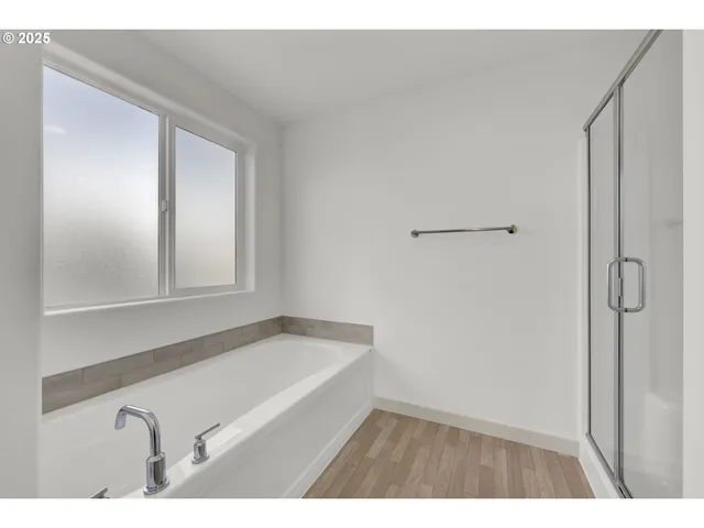 a bathroom with a tub and a sink