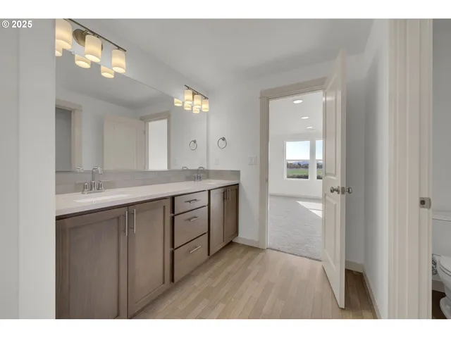 a bathroom with a sink a mirror and a shower