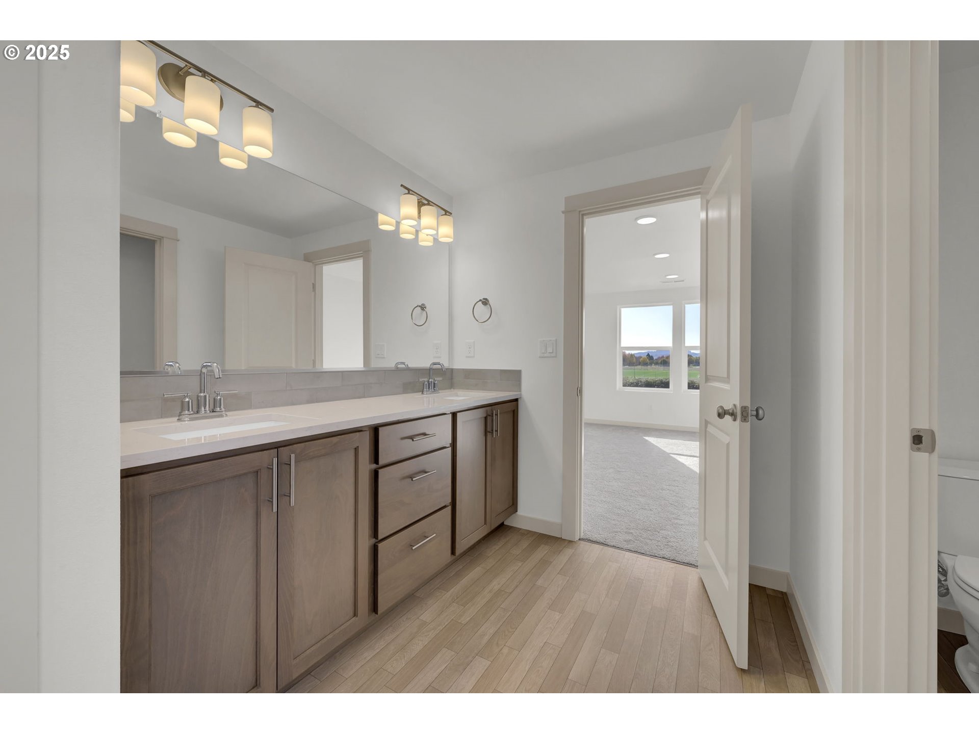 5653 Magnificence Way Eugene, OR 97402 - Photo 28 of 44 a bathroom with a sink a mirror and a shower