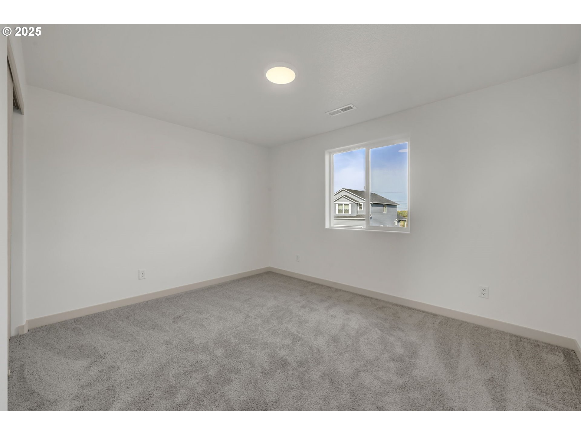 5653 Magnificence Way Eugene, OR 97402 - Photo 32 of 44 a view of an empty room with a window