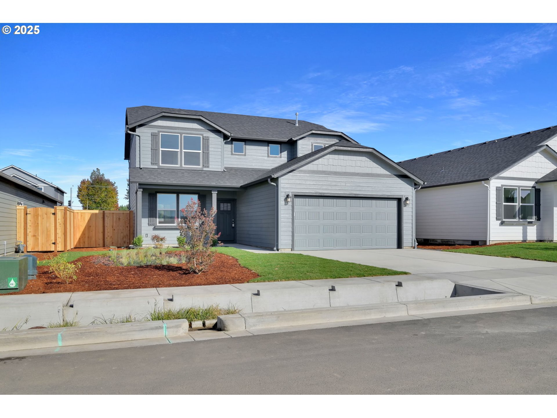 5653 Magnificence Way Eugene, OR 97402 - Photo 34 of 44 a front view of a house with garden