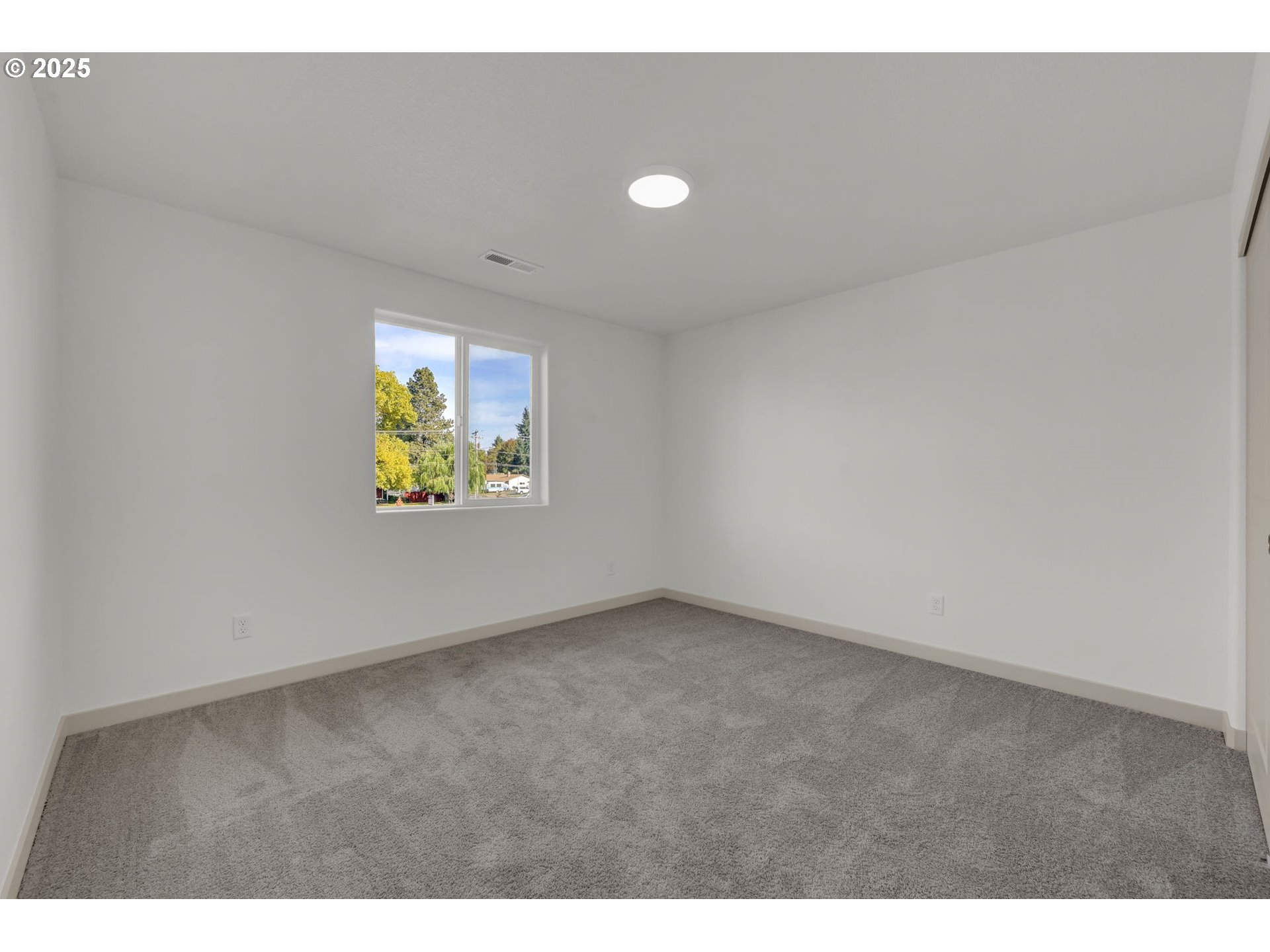 5653 Magnificence Way Eugene, OR 97402 - Photo 35 of 44 a view of an empty room and a window