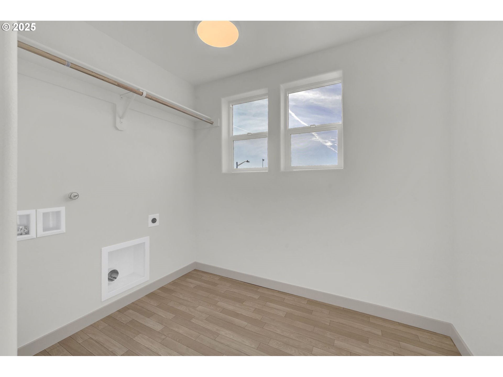 5653 Magnificence Way Eugene, OR 97402 - Photo 37 of 44 a view of an empty room with wooden floor and windows