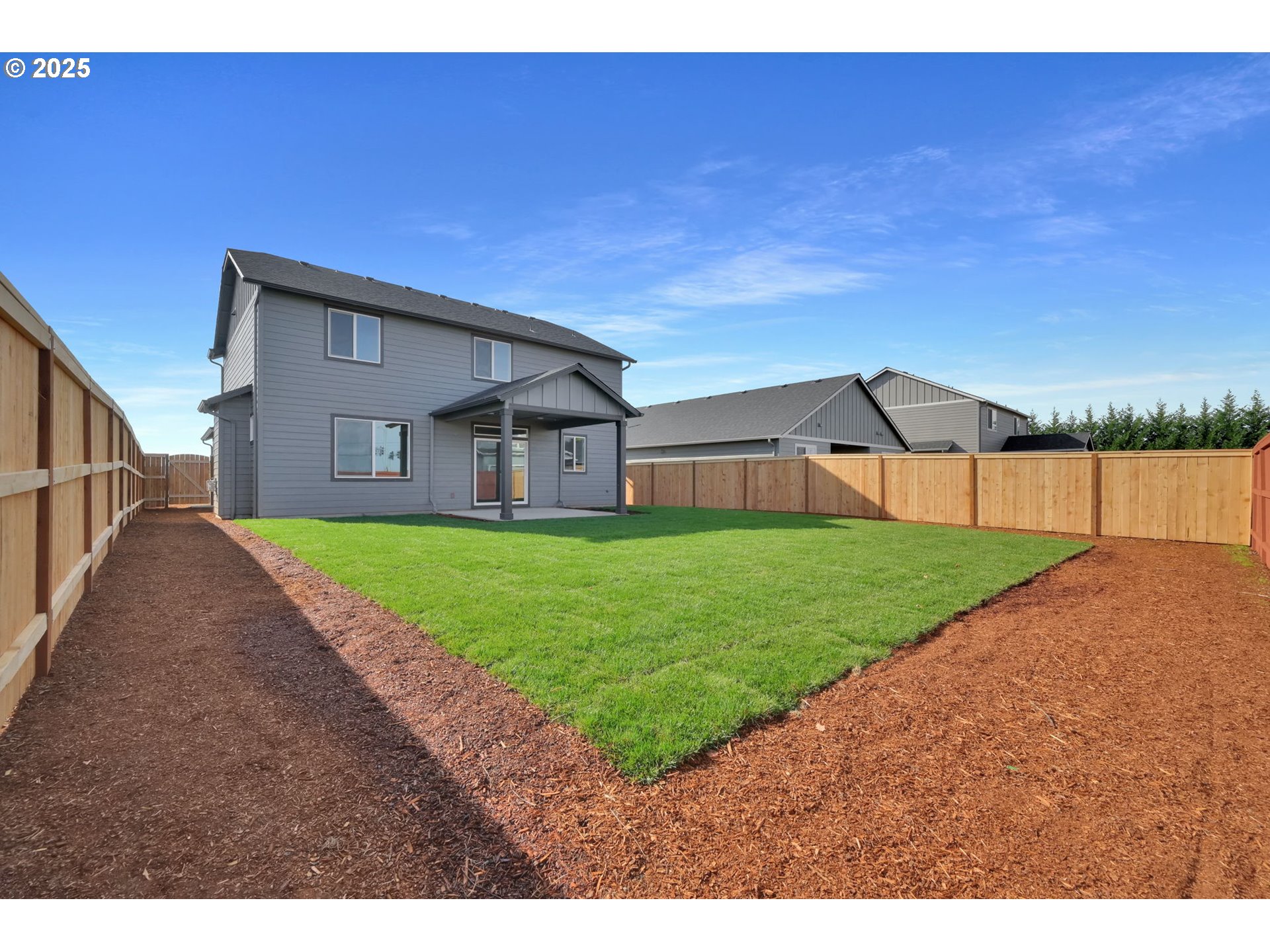 5653 Magnificence Way Eugene, OR 97402 - Photo 41 of 44 a view of a house with a yard and garage