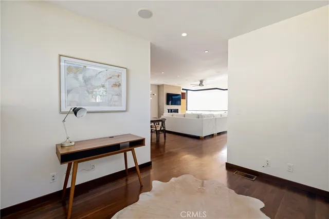 a view of a livingroom with furniture and a workspace